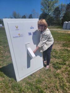 Karin Berry, Managing Director of NT Solar, "flips the switch" at the Vanderbilt I Solar Farm in Bedford County, Tennessee